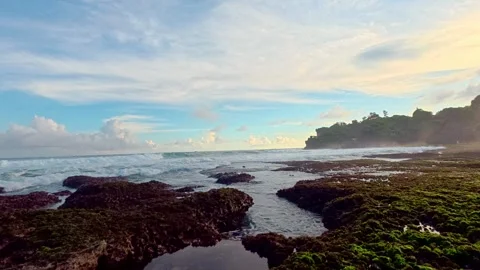 Wide rocky tidal pools under dramatic coastal sky Video stock 335442751