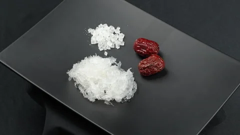 Wide Rotating Black Plate With Bird Nest Sugar And Red Dates Stock Footage 339371364