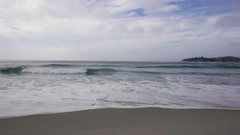 Wide sandy beach and cloudy sky, Pacific Coast, California Stock Footage 220956501