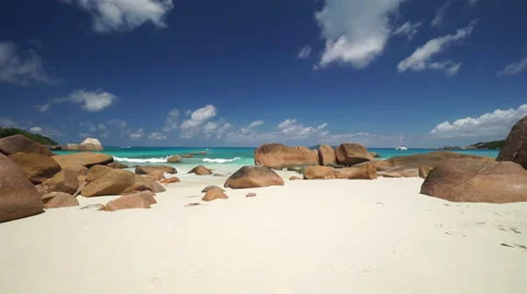 Wide sandy beach with granite rocks Stock Footage 45547435