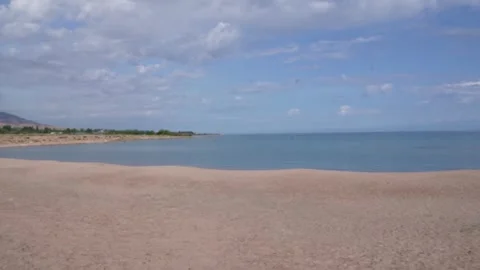 Wide sandy beach on the Issyk Kul lake, Kyrgyzstan Stock Footage 345408862