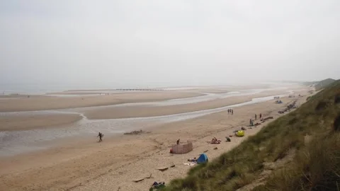 Wide Sandy Sea Beach at Low Tide With Vacationing People Stock Footage 245285127