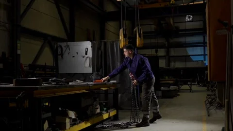 Wide scene of worker using crane Stock Footage 266606475