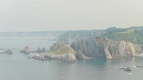 Wide scenic view of dramatic rocky cliffs and rugged coastline at the edge of El Stock Footage 346714140