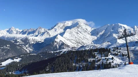 Wide scenic view of the snow-covered Mont Blanc massif in the French Alps, with Stock Footage 346708976