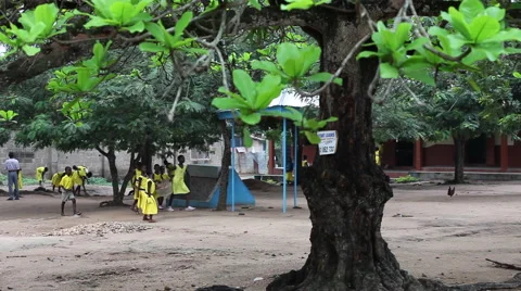 WIDE: SCHOOL YARD - PAN TO NEW SANITATION FACILITY Stock Footage 60115888