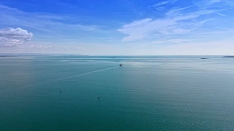 Wide seascape with distant cargo ship and navigation buoys, Burgas Bay. Stock Footage 337063792