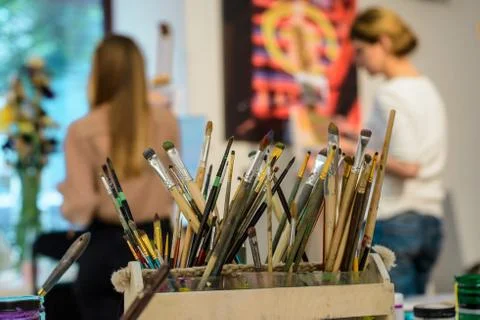 Wide selection of artistic brushes on the background Stock Photos
