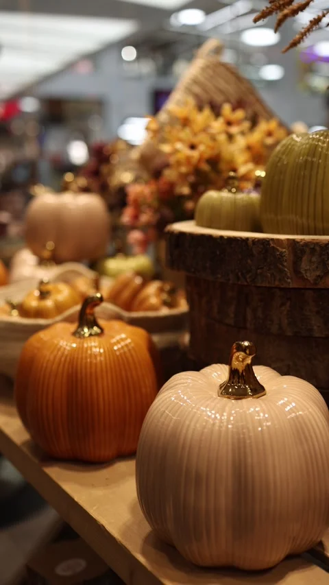Wide selection of Halloween ceramic pumpkins in various colors sizes and styles  Vídeo Stock 346973835