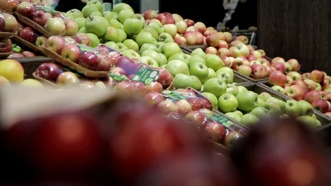 A wide selection of ripe red apples at the fruit market, retail Stock Footage 128240209