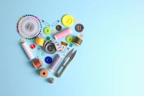A wide selection of sewing materials and tools in the shape of a heart on a Stock Photos