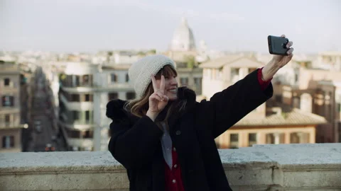 Wide shot on 4k RED camera. Beautiful fashionable Italian woman taking selfies w Video stock 199462145