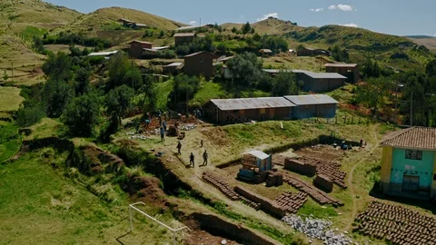 Wide shot of Adobe building construction site in the Andes, Peru Stock Footage 115369772