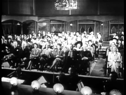 Wide shot of audience watching performance in theater Stock Footage 260255736