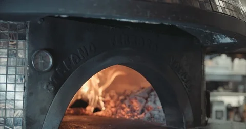 Wide shot on an authentic brick oven with an open wood fired flame Stock Footage 105308560