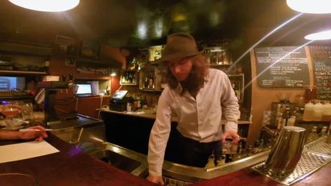 Wide Shot of Bartender Standing Behind Bar Counter Vídeo Stock 344848210
