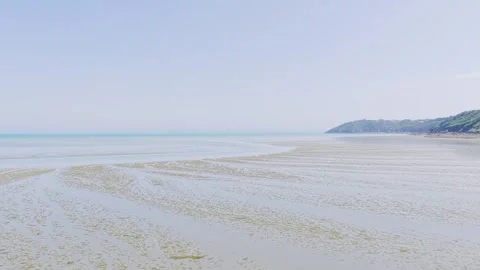 Wide shot of Binic beach on the Brittany coast of France during low tide, with Stock Footage 346669216