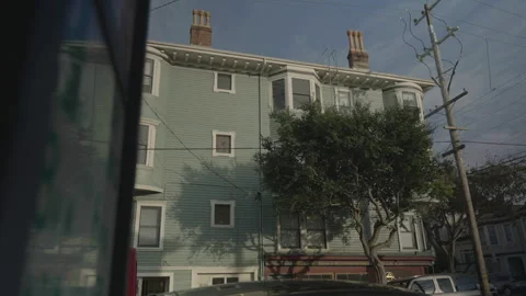Wide shot of blue building with tree and soft sunlight, San Francisco Stock Footage 333580691