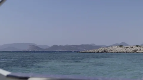 Wide shot of the blue sea sky with sunny weather taken from a boat in Ibiza, the Stock Footage 107631753