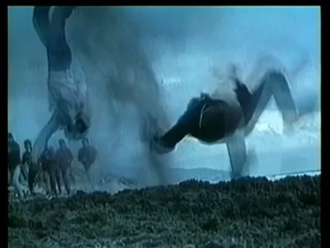 Wide shot bomb exploding and knocking over several men 库存影片 260240501