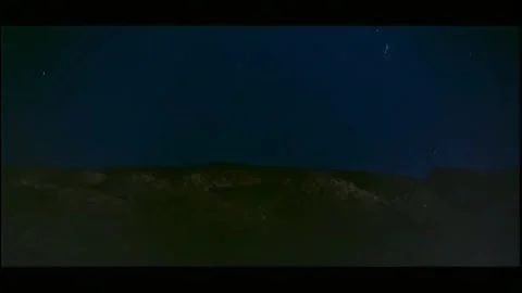 Wide shot bombs exploding in night sky Vídeos de archivo 260248048