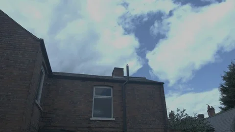 Wide shot of brick house with clouds Video stock 78462357