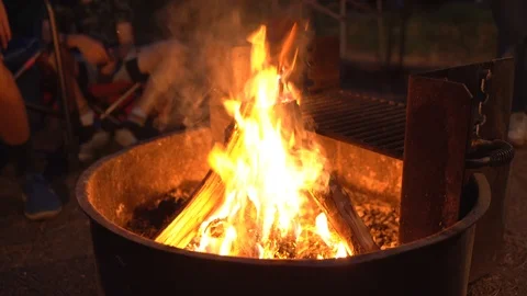 Wide shot of burning camp fire and grill Stock Footage 114259647