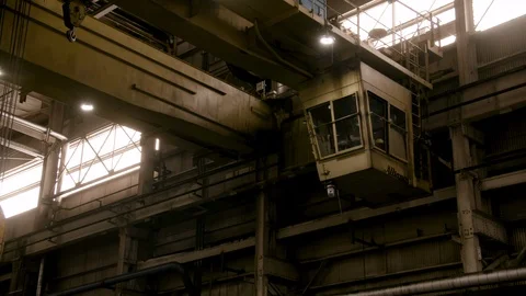 Wide Shot of Cabin of Steel Mill Crane moves - Steel Roll Wipes frame Stock Footage 89944537