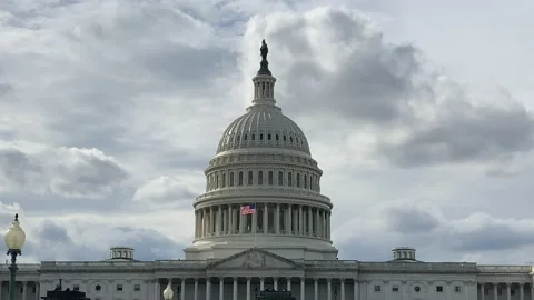 Wide shot of Capitol Building on a cloudy day with slow pan down Stock Footage 141831188