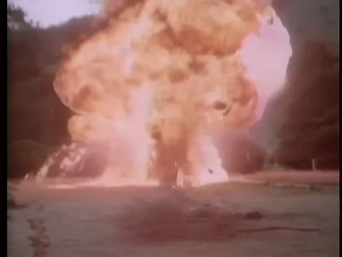 Wide shot of car exploding in open field Stock Footage 260251458