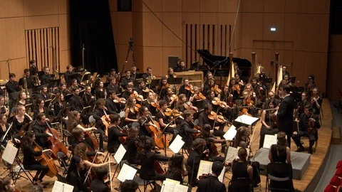 Wide shot of classical orchestra playing a symphony Stock Footage 118887958