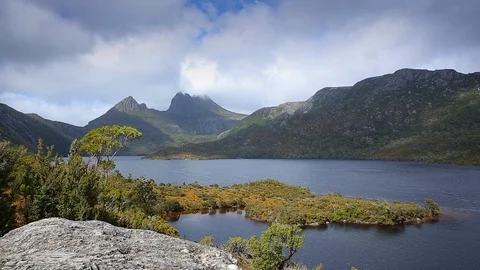 Wide shot of clouds passing over Cradle mountain Stock Footage 112318600