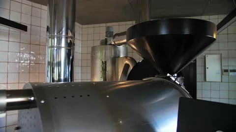 Wide shot of coffee roaster machine at the factory.Professional industry area of Stock Footage 214340746