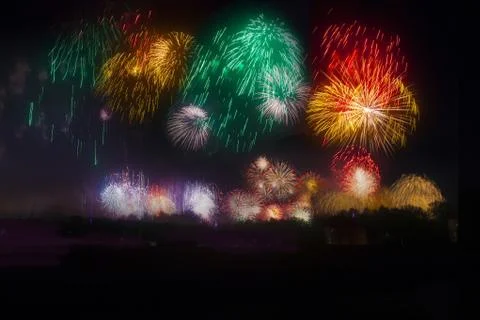Wide shot of colorful fireworks exploding in the night sky Foto stock