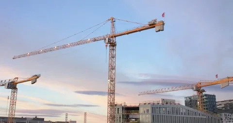 Wide shot of construction cranes over Oslo city Stock Footage 245990360