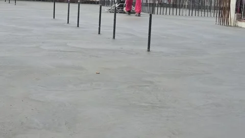 Wide Shot of Construction Worker Operating Power Trowel on Concrete. Stock Footage 332245908