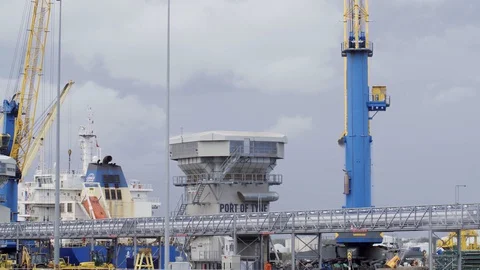 Wide shot of container yard with moving cranes Stock Footage 127585217