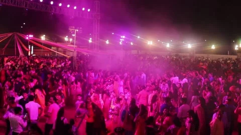 Wide shot of a crowd dancing in a garba event Stock Footage 156408142