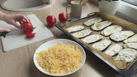 Wide Shot Cutting Tomatoes On Board With Eggplant And Cheese Ready For Cooking Video stock 336445923