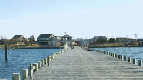 Wide shot of a dock on the ocean Stock-Footage 76591326