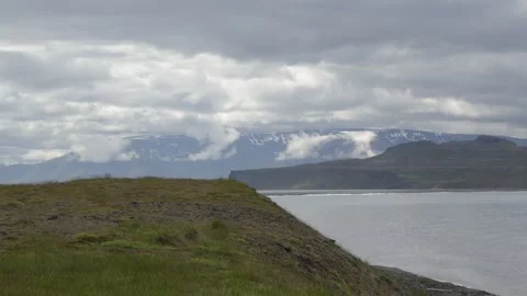 Wide Shot of the Dramatic Icelandic Coastal Landscape with Distant Mountains Stock Footage 339807891