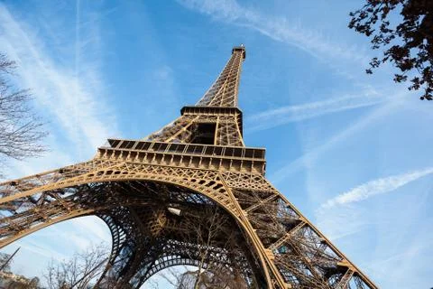 Wide shot of Eiffel Tower with blue sky in Paris Stock Photos