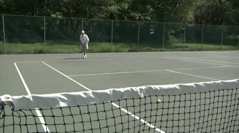 Wide Shot of Elderly Man Playing Geriatric Tennis Stock Footage 11016594