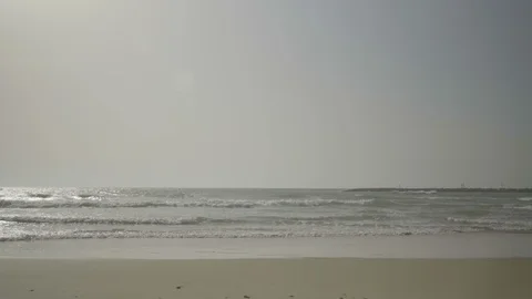 Wide shot of an empty beach in the afternoon Stock Footage 88767407