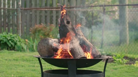 Wide Shot of Fire Pit in Humble Suburban Neighborhood, camping in backyard Stock Footage 131115875