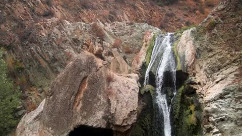 Wide Shot of a Flowing Waterfall on a Cloudy Day Stock Footage 219345380