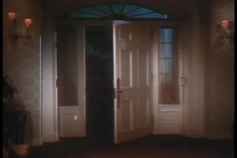 Wide shot of front door opening by itself Видео 11354095