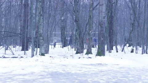 Wide shot of group of people playing volleyball on an outdoor court in winter Stock-Footage 107617536