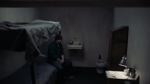 Wide shot of guard conducting random cell search, 2000s, USA - Reenactment 스톡 동영상 243735692