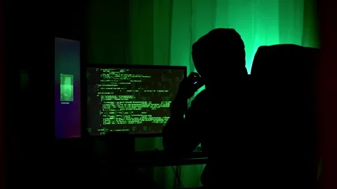 Wide shot of hacker executing a cyber attack, hacking code data leak in matrix Stock Footage 297678307